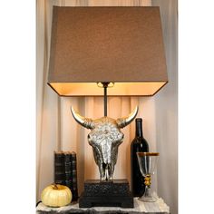 a table lamp with a cow head on it