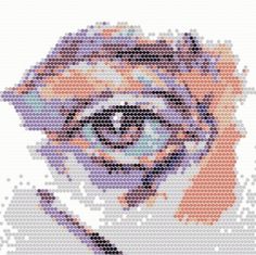 a cross stitch pattern with an eye on it