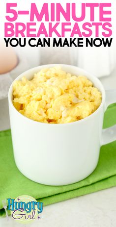 a white bowl filled with scrambled eggs on top of a green napkin