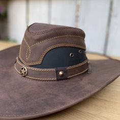 The price INCLUDES sales taxes and SHIPPING costs within the United States
This authentic leather hat, with its distinctive design and a star on the hat band, is a must-have accessory for a unique style. With a 3" brim and 4" crown, this hat includes an adjustable drawstring for the perfect fit. Made 100% in Mexico, it is ideal for those looking for a quality leather hat with a touch of distinctive character.
Description of the Hat:
Because this hat is made of 100% genuine leather, the color of Leather Hat Pattern, Brown Leather Hat, Leather Top Hat, Leather Working Projects, Mens Cowboy Hats, Leather Cowboy Hats, Brown Cafe, Leather Craft Patterns, Leather Hat