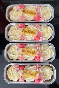 three plastic containers filled with cupcakes covered in frosting