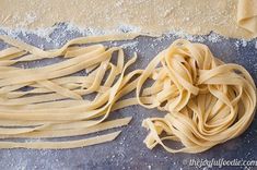 some uncooked pasta sitting on top of a table