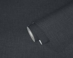 a close up view of a dark gray fabric