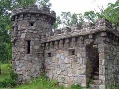 an old stone building with two towers on each side