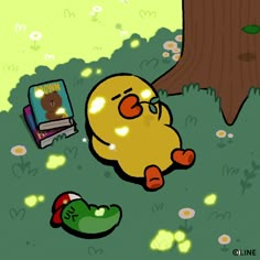 a cartoon character laying in the grass next to a tree and an open laptop computer