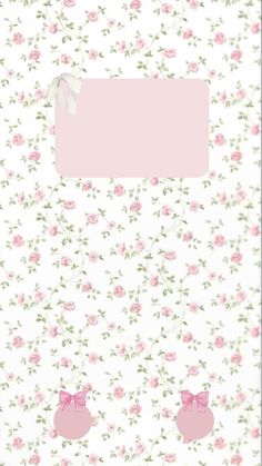 a pink and white flowered wallpaper with two little pigs on it's side