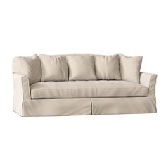 a white couch with four pillows on the back and one arm folded out to show it's fabric