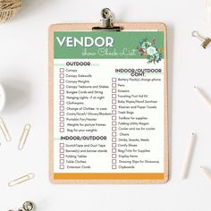 a clipboard with an outdoor checklist on it next to some paper clips and scissors