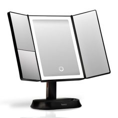 a black and white mirror on a stand