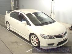 a white car parked in a parking space