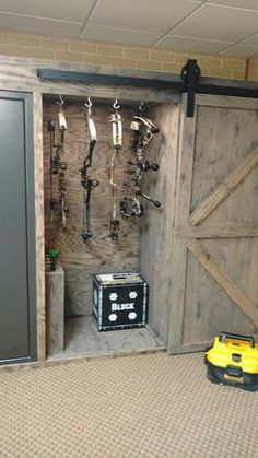 a room that has a bunch of tools on the wall and some shelves in it