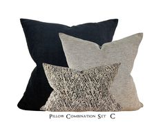 three pillows with black and white designs on them