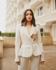 Make your special day even more stylish with our exquisite White Personalized Hand-Embroidered Peplum Style Blazer Jacket and Fit Flare Pants ensemble. Perfect for brides, bridesmaids, or any fashion-forward woman, this stunning outfit is meticulously crafted with intricate hand embroidery to add a touch of bespoke elegance to your wedding, cocktail party, prom, or Christmas celebration. The blazer's peplum style enhances the feminine silhouette, and the fit flare pants offer a modern and sophisticated flair. Designed for those who appreciate personalized luxury, this ensemble allows you to showcase your unique style on a momentous occasion. The crisp white hue exudes purity and sophistication, making it a timeless choice for any celebration. Whether you're the bride looking for a standout Pants Bride, Estilo Kardashian, Christmas Attire, Pant Suits For Women, Womens Suits, Cocktail Outfit, Manish Malhotra, Vogue India