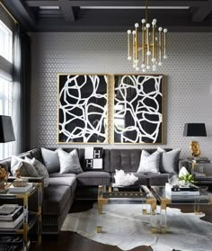 a living room filled with furniture and a chandelier