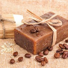 a bar of soap sitting on top of coffee beans