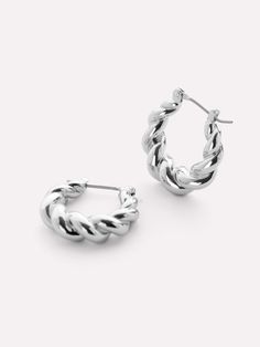 One of our most loved pieces, our twisted hoop Paris earrings, now for our silver babes. A little twisty, a little bendy, a lot of style—these rhodium-dipped hoop earrings are the perfect statement to wear everywhere, every day. Wear our silver twisted hoop earrings alone or pair them with other silver statement pieces like our Rox Mini Silver. • Rhodium-dipped huggie hoops • Features a unique textured look • 365-day warranty Daily Earrings, Twist Hoop Earrings, Silver Sisters, Twisted Hoop Earrings, Sleek Updo, White Gold Hoops, Everyday Earrings, 925 Sterling Silver Earrings, Gold Hoop