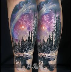 this is an image of a man's leg with tattoos on it and trees in the background