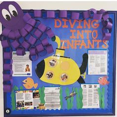 a bulletin board with an image of a yellow submarine and other marine life on it