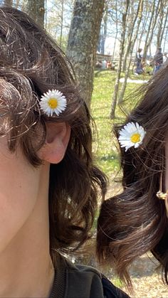 two women with flowers in their hair