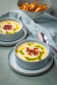 two bowls of soup with bacon and chives