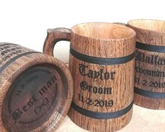 three wooden mugs sitting next to each other