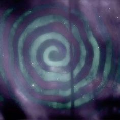 an image of a green and purple swirl