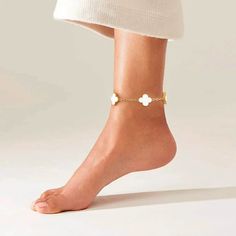 Step into a world of charm and enchantment with the Clovers Anklet. The intricately designed clover charms, delicately suspended on a sleek chain, create a mesmerizing piece that adds a touch of whimsical beauty to your ankle. Embrace the magical allure of the clover symbol and let it accompany you on your journey to success and happiness. Now available in black and white. White Metal Anklet Perfect For Gifting, White Metal Anklets For Gift, White Metal Anklet As Gift, Chic Adjustable Chain Anklet For Gift, Chic Adjustable Anklets As A Gift, Clover Symbol, Success And Happiness, Clover Charm, Beautiful Handbags