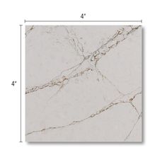 a white marble tile with gold veining on the edges and bottom, showing measurements