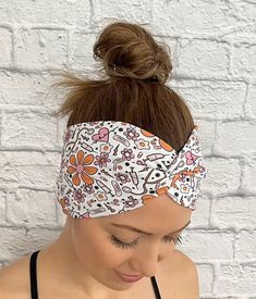 white twist headband with orange and pink medical theme print and flowers Cute Adjustable Headband Headwrap, Cute Adjustable Headband Style Headwrap, Cute Adjustable Headwrap Styled As A Headband, Trendy Bandeau Headwrap One Size Fits Most, Trendy Bandeau Headwrap One Size, White Bandana Headband For Spring, Casual One Size Matching Headband Hair Accessories, Casual Bandeau Headband For Spring, Trendy White Adjustable Bandana