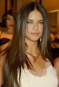 a beautiful young woman with long brown hair