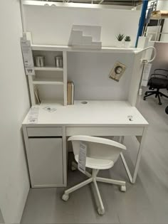 a white desk and chair in an office