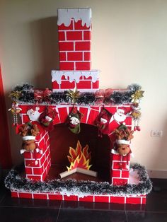 a red brick fireplace decorated with christmas decorations