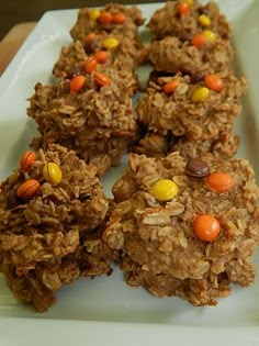 cookies with candy and candies are arranged on a plate