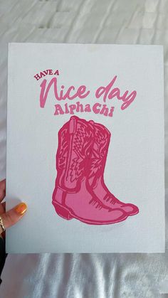 a hand holding up a card that says have a nice day alphagh