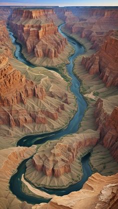 an aerial view of the grand canyons and rivers in the desert, with blue water running through them