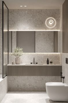 a modern bathroom with two sinks and a bathtub in the middle of the room