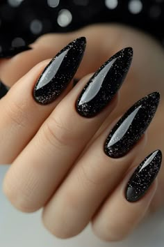 Add a touch of dark elegance and glamour with these black glitter stiletto acrylic nails. Perfect for those who love a bold and sophisticated style, these nails feature a sleek stiletto shape and sparkling black glitter, making them ideal for special occasions or a night out. #AcrylicNails #StilettoNails #BlackNails #GlitterNails #NailArt #NailDesign #Manicure #GlamNails #NailInspiration Nails For Night Out, Black Silver Almond Nails, Black Spooky Nails Almond, Black Nails Inspiration Almond, Dark Neon Nails, Neutral Goth Nails, Black Sparkly Nails Almond, Sharp Black Acrylic Nails, Black Glittery Nails Acrylic