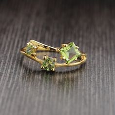 Metal : Solid Sterling Silver with 925 Stamp. Stone : Natural Peridot Ring Weight - 2.2 gm . Stone Size - 3x3mm Round, 4x4mm Round, 5X5mm Square Peridot And Citrine Ring, Green Peridot Birthstone Ring For May, Green Peridot Birthstone Ring With Prong Setting, Green Peridot Birthstone Ring, Fine Jewelry Emerald Green Rings, Lime Green Peridot Rings In Fine Jewelry Style, Lime Green Peridot Rings Fine Jewelry, Green Sapphire Open Ring, Green Birthstone Open Ring For Promise