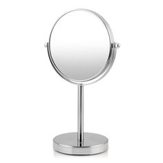 a small round mirror on a metal stand