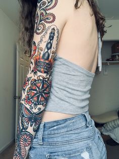 a woman with a tattoo on her arm