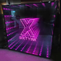 a large neon sign with the word skylink on it in front of a purple background