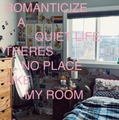 a bedroom with pictures on the wall and a bed in front of a window that says romanticize a quiet life theres no place like my room