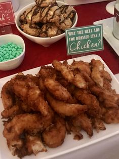 there are many different types of food on the table at this party, including fried chicken and green beans