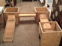 some wooden benches sitting on the floor in a room with carpeted floors and walls