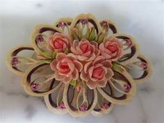 a bunch of pink flowers sitting on top of a white counter