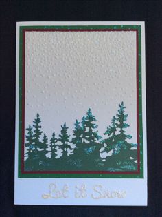 a card with trees and the words let it snow