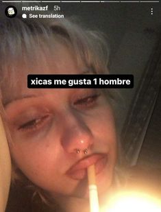 a woman holding a lit candle in her mouth with the caption'xicas me gusta 1 hombre '