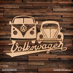 the volkswagen vw camper and beetle wood wall art is shown on a wooden background