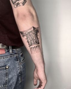 a man with a tattoo on his arm