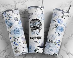 three personalized tumbles with blue flowers and the words emoquite on them